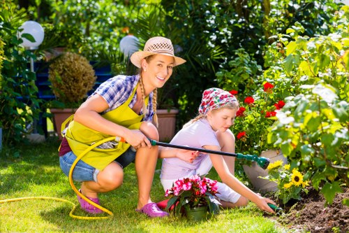 Team member communicating with a customer about inclusive on-site hedge trimming arrangements